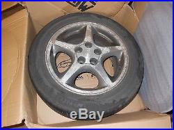 4 toyota celica coupe alloy wheels, tyres and bolts, center caps, locking nuts
